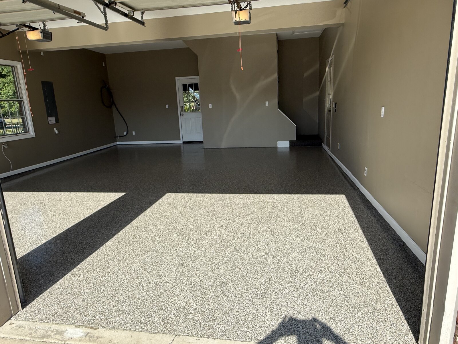 Two-car garage with gray full-flake epoxy floor coating